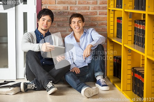 Image of Students With Digital Tablet Sitting In University Library