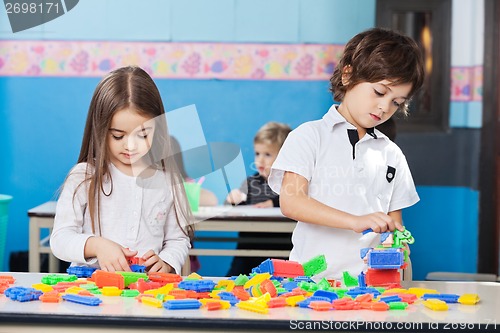 Image of Children Playing With Construction Blocks
