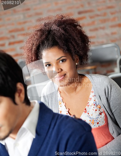 Image of College Student With Classmate In Classroom