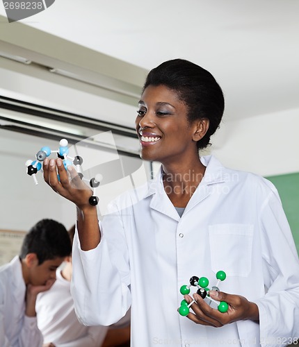 Image of Teacher Analyzing Molecular Structure In Lab