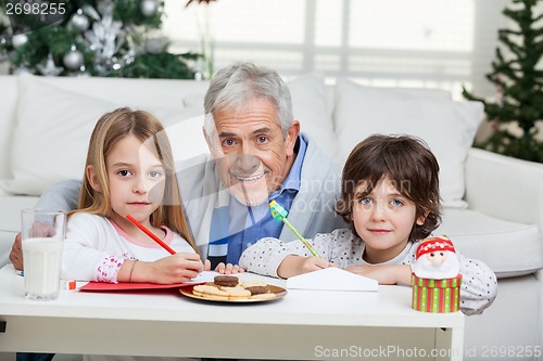 Image of Grandfather And Children With Cardpapers