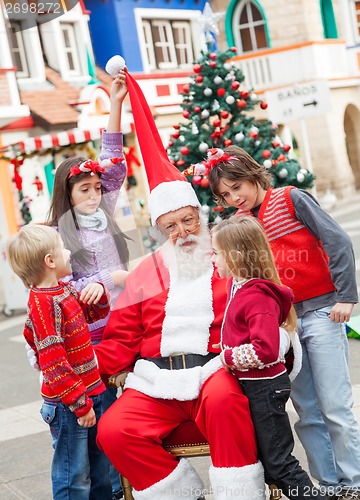 Image of Santa Claus And Children In Courtyard