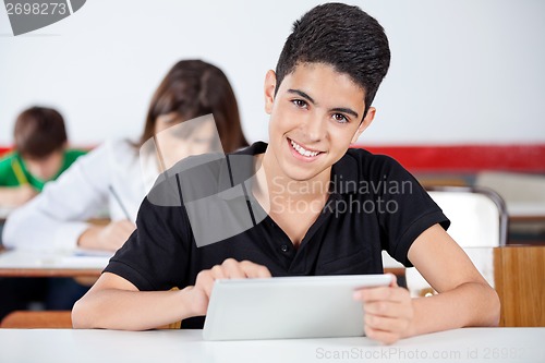 Image of Portrait Of Teenage Schoolboy Using Digital Tablet