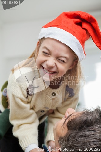 Image of Cheerful Girl Being Carried By Father