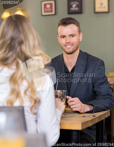 Image of Smart Businessman With Female Colleague At Cafe