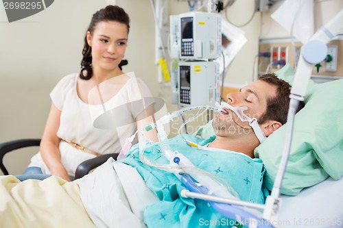 Image of Woman Looking At Patient Resting