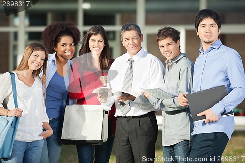 Image of Confident Professor And Students Standing On University Campus