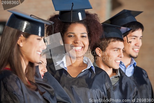 Image of Woman With Friends On Graduation Day At College