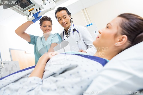 Image of Medical Team Preparing Patient In Xray Room