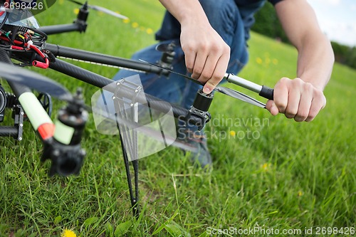 Image of Technician Tightening Propeller Of UAV Drone