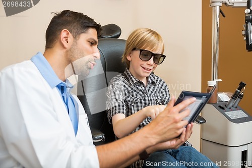 Image of Young Boy Taking Stereoacuity Test