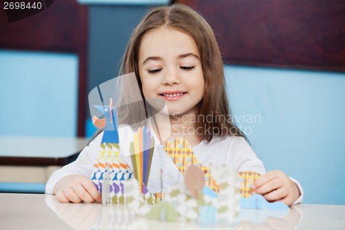 Image of Girl Making Craft In Preschool