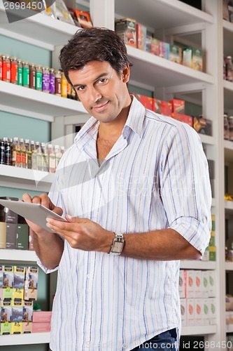 Image of Handsome Man With Tablet In Supermarket