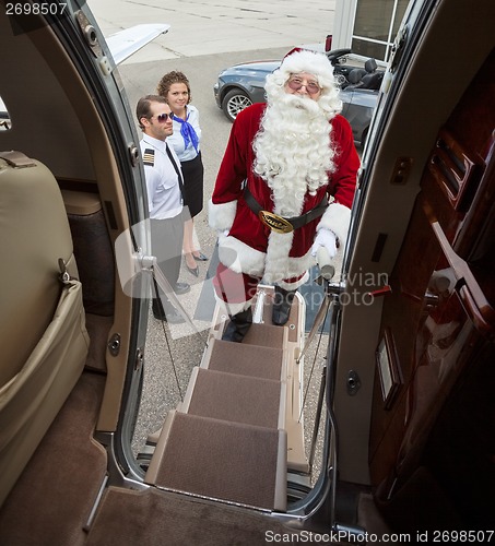 Image of Portrait Of Santa Boarding Private Jet