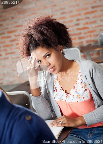 Image of Student Thinking While Giving Test In Classroom