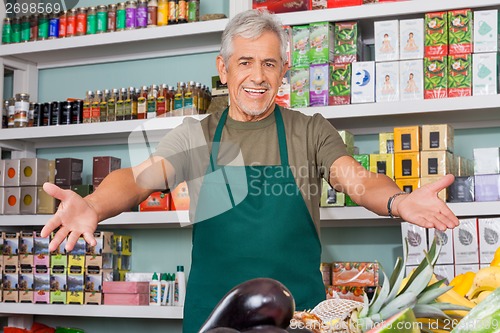 Image of Salesman With Arms Outstretched Supermarket