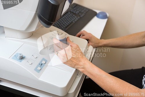 Image of Optometrist Using Digital Retina Camera