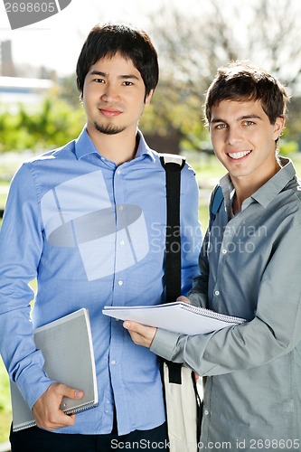 Image of Students With Books Standing On College Campus