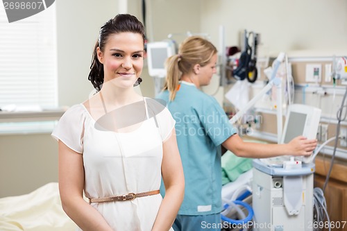 Image of Young Woman With Nurse Working In Hospital