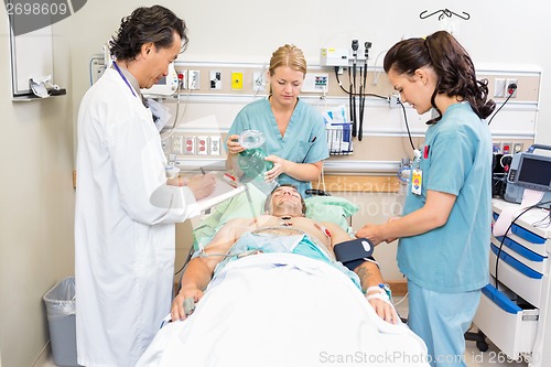 Image of Doctor And Nurses Treating Critical Patient