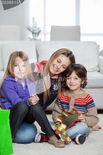 Image of Loving Mother With Children At Home