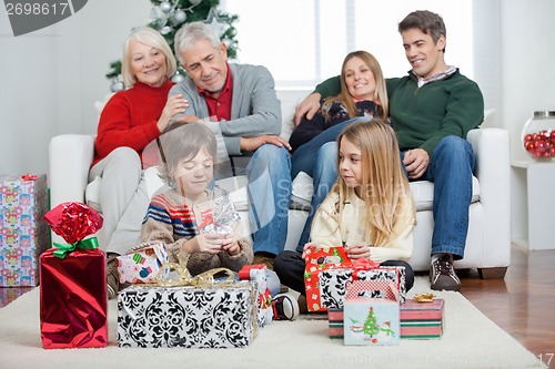 Image of Three Generation Family With Christmas Presents