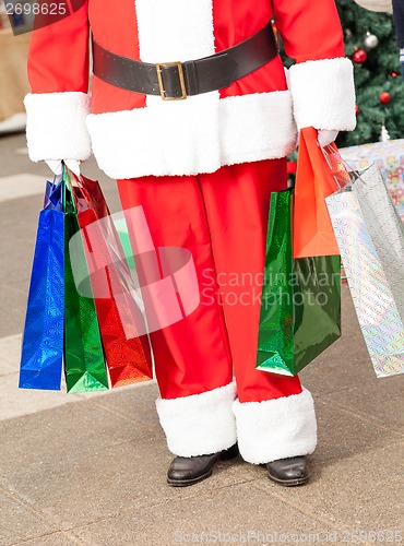 Image of Santa Claus Carrying Shopping Bags