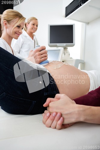 Image of Pregnant Woman Getting Checked By Obstetricians