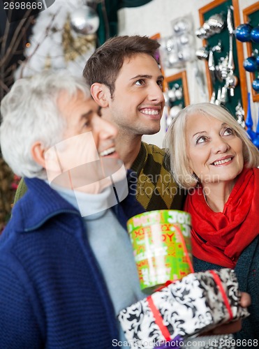 Image of Happy Family Shopping In Christmas Store