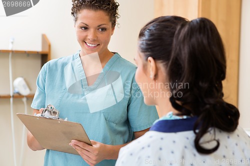 Image of Nurse Looking At Patient In Ultrasound Room