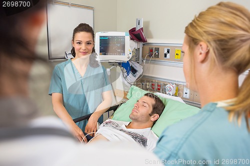 Image of Nurse With Medical Team in Emergency