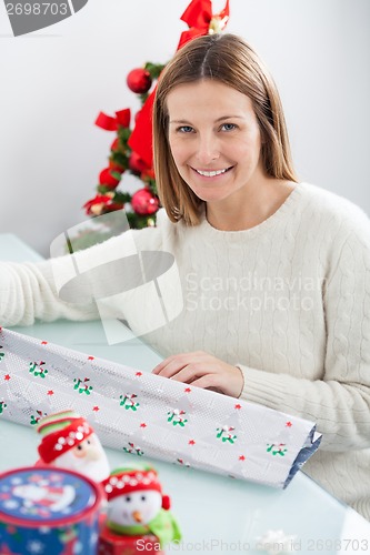 Image of Woman With Decorative Wrapper At Home