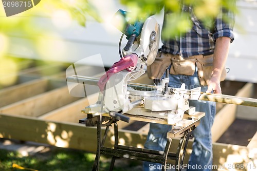 Image of Anonymous Carpenter with Table Saw