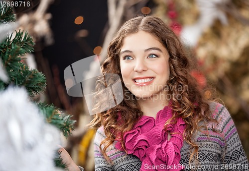 Image of Beautiful Young Woman In Christmas Store