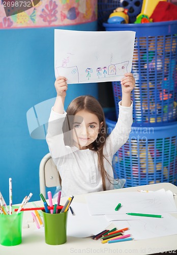 Image of Girl Showing Drawing Paper In Art Class