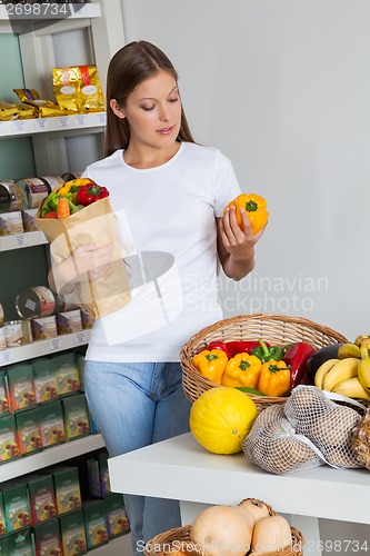 Image of Woman Shopping Bellpeppers In Supermarket