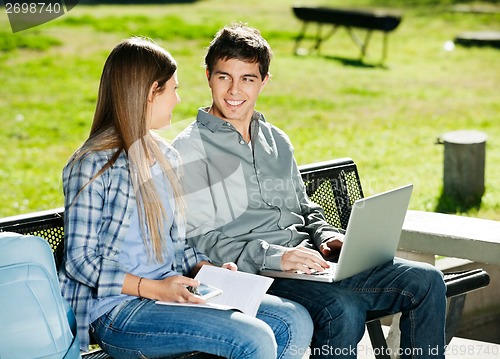 Image of Students With Book And Laptop In Campus