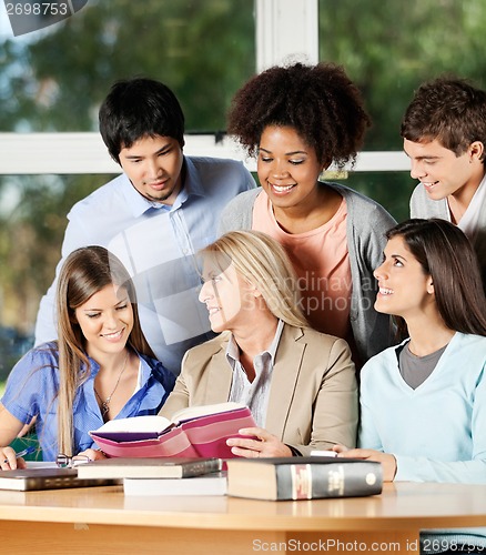 Image of Female Teacher Explaining Students In Classroom