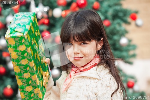 Image of Girl Holding Christmas Present