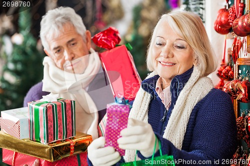 Image of Woman Buying Presents With Man In Store
