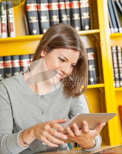 Image of Woman Using Digital Tablet In College Library
