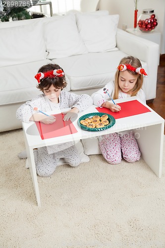 Image of Siblings Making Christmas Greeting Cards