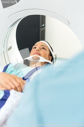 Image of Patient Undergoing CT Scan In Examination Room