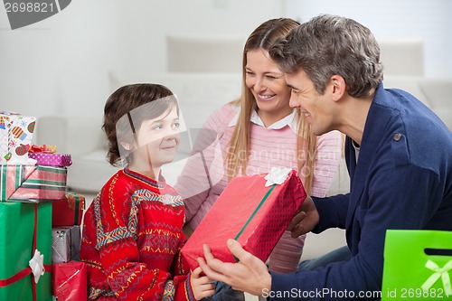 Image of Father Giving Christmas Gift To Son