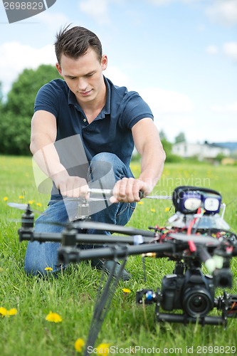 Image of Engineer Fixing Propeller Of UAV Drone