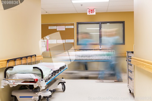 Image of Nurses Walking In Hospital Corridor