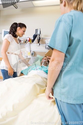 Image of Worried Woman Looking At Patient