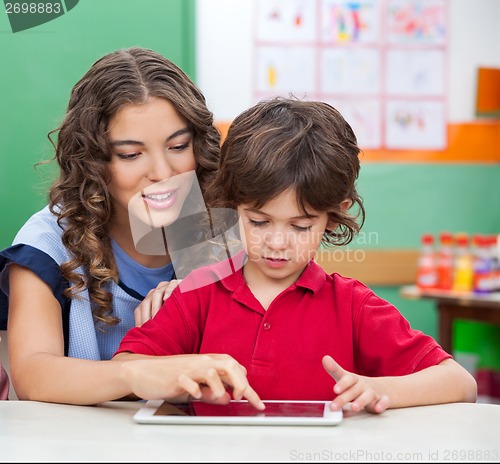 Image of Teacher Teaching Students To Use Digital Tablet