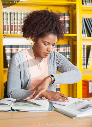 Image of Student Studying At Table In University Library