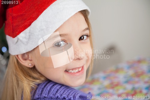 Image of Happy Girl Wearing Santa Hat